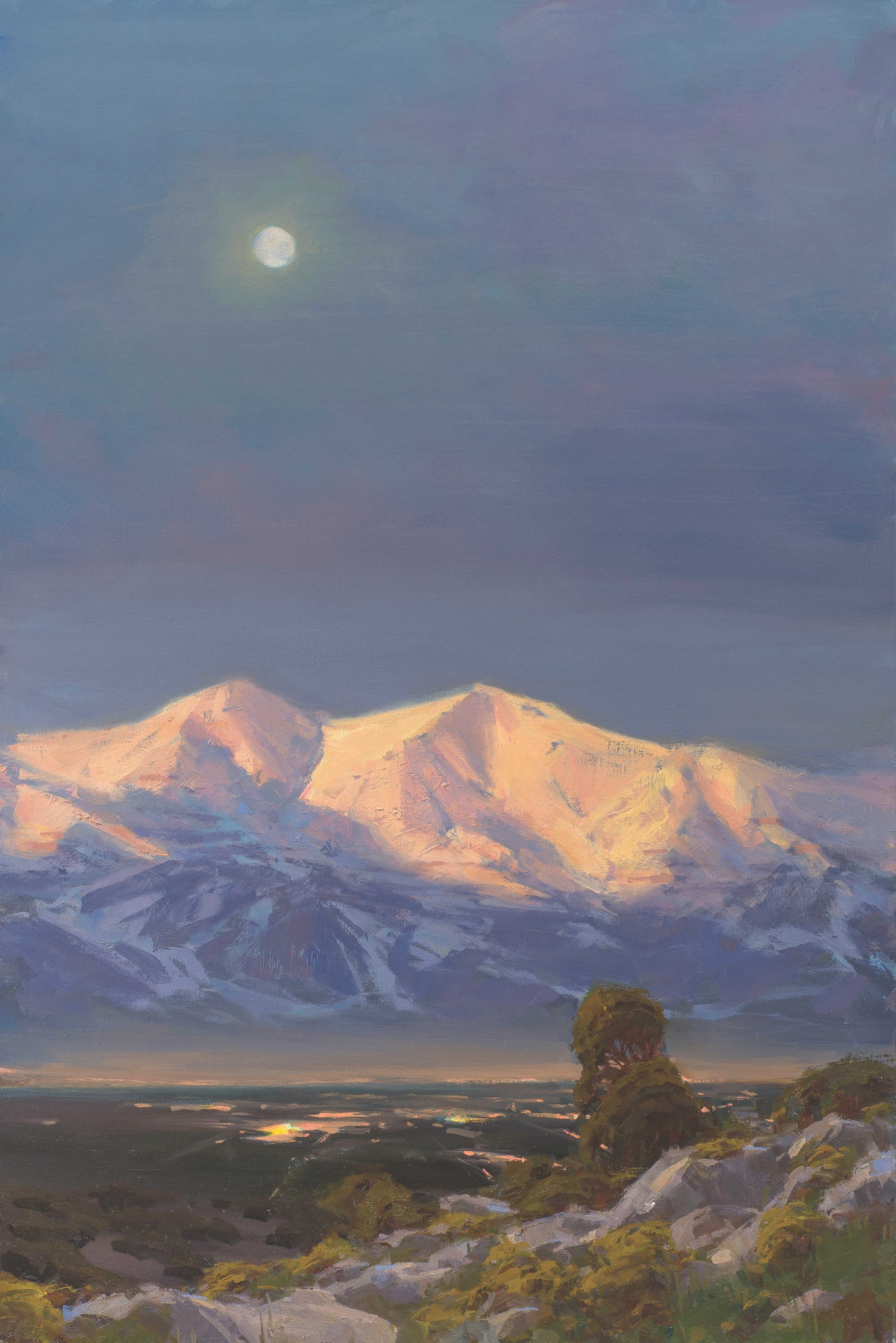 Landscape painting depicting snow covered mountains in Utah under a moonlit evening. There are rocks, sage and trees in the foreground, and lights in buildings in the Salt Lake Valley below the mountains.