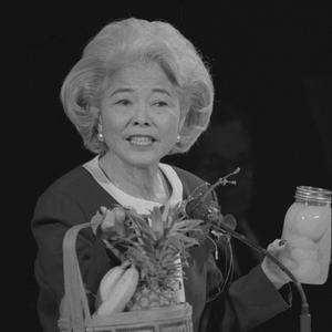 Shown delivering a general conference address, 1996. Okazaki was a prolific writer and popular speaker. A former elementary school teacher and principal, she frequently employed visual aids when she spoke.