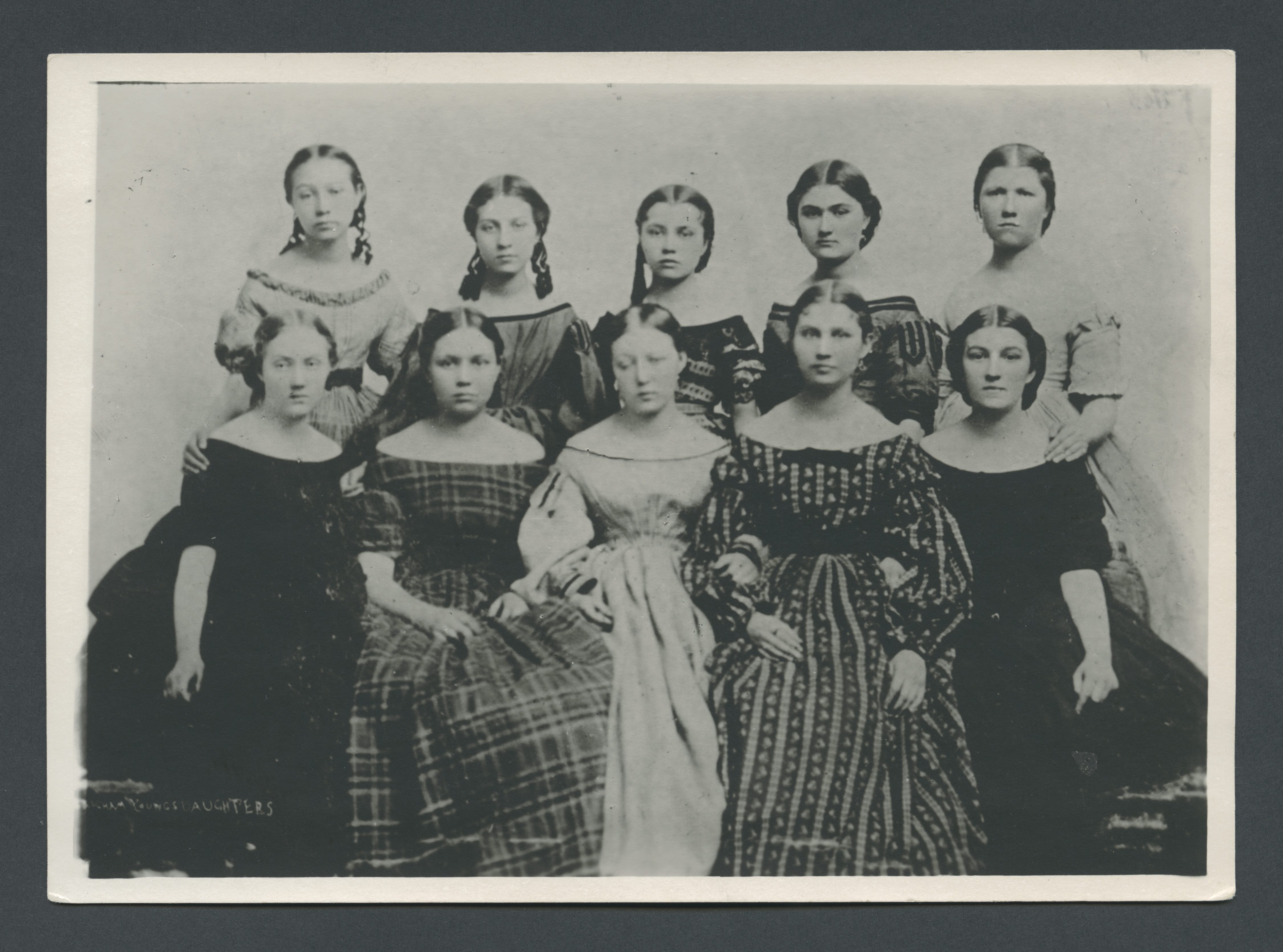 <strong>Ten of Brigham Young’s daughters.</strong> 1865. As social leaders in the Latter-day Saint community, these young women were positioned to lead the new junior retrenchment movement. Ella Young Empey, center front, served as the first president of the Young Ladies’ Department of the Ladies’ Cooperative Retrenchment Association. Maria Young Dougall, top right, was one of Ella’s counselors and later served as a counselor in the YLMIA general presidency from 1887 to 1904. (Image courtesy Church History Library, Salt Lake City.)