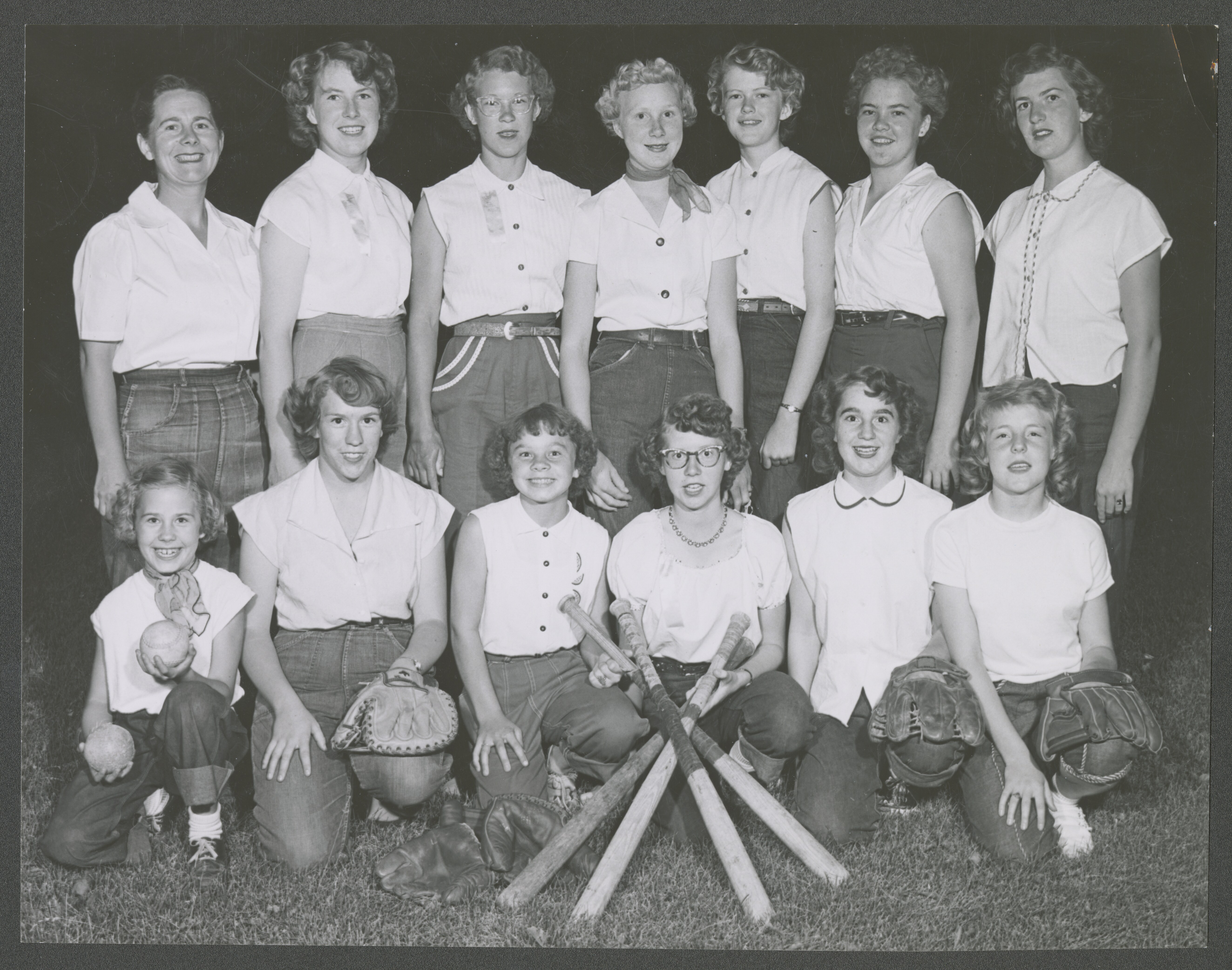 <strong>Blackfoot Fourth Ward YWMIA softball team.</strong> 1953. This team from Blackfoot, Idaho, took home the prize from a stake softball competition. Women’s and men’s sports were a significant component of the MIA program and were an effective missionary tool to introduce other young people to the church. (Image courtesy Post Register [Idaho Falls, ID], copy at Church History Library, Salt Lake City.)