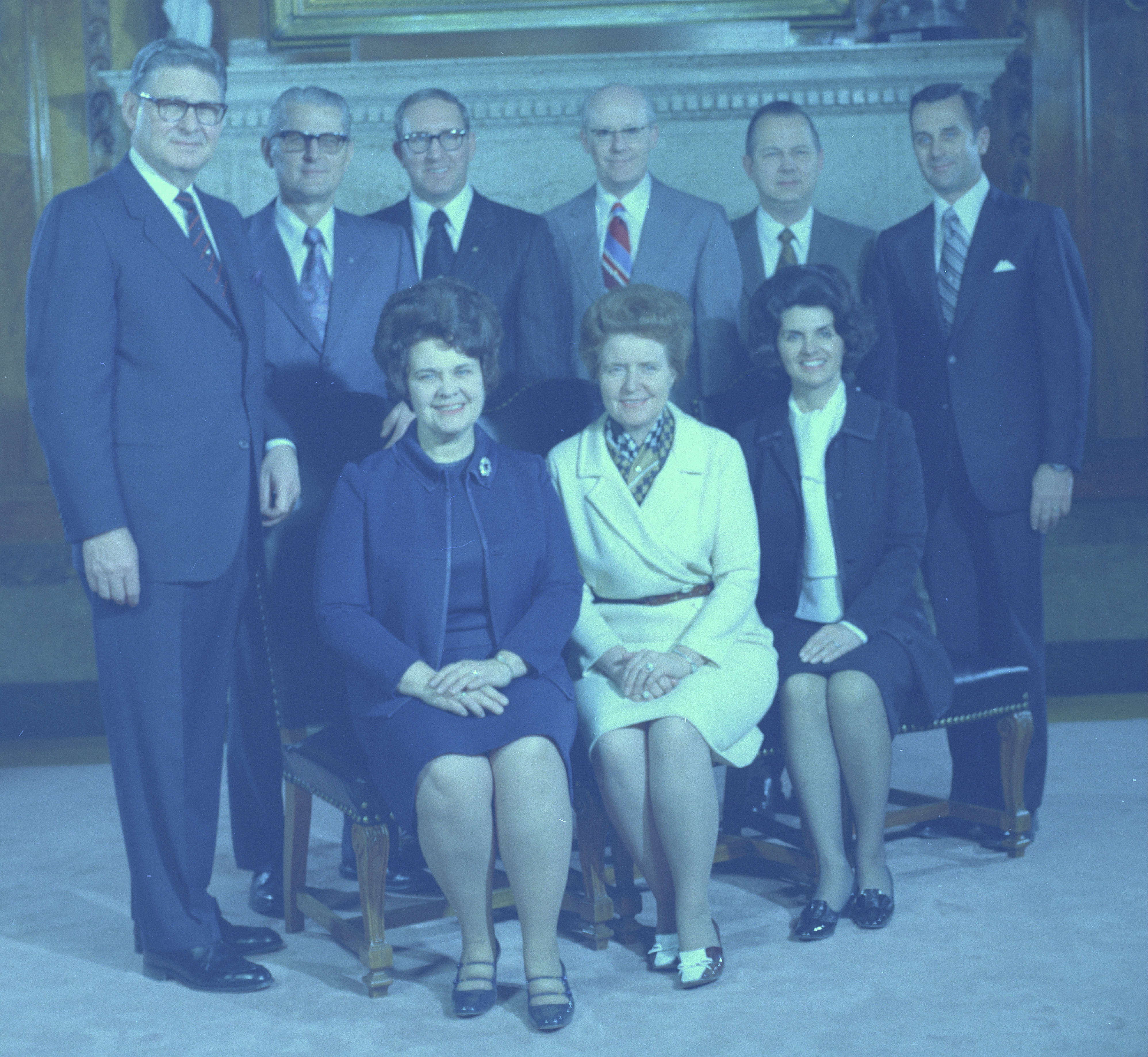 <strong>APMIA presidencies and advisers.</strong> 1972. From 1972 to 1974, the combined presidencies of Ruth Hardy Funk and Robert L. Backman worked closely with the Presiding Bishopric to reshape and realign the church’s youth organizations, then known as Aaronic Priesthood MIA. Seated, left to right: APMIA–Young Women president Ruth Funk, Hortense Hogan Child, and Ardeth Greene Kapp. Standing, left to right: presiding bishop Victor L. Brown, H. Burke Peterson, Vaughn J. Featherstone, APMIA–Young Men president Robert L. Backman, LeGrand R. Curtis Sr., and Jack H. Goaslind. (Image courtesy <em>Church News</em>, copy at Church History Library, Salt Lake City.)