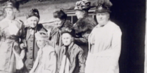 

<p>This silent film from circa 1919–1920 shows Emmeline B. Wells and other Latter-day Saint women leaders at the Deuel log home in Salt Lake City. The women in the film are identified as follows (see 1:26 in the film): </p>


<p> </p>


<p>Seated from left to right: <br/>
Person 1: Emmeline B. Wells <br/>
Person 2: Elizabeth Claridge McCune </p>


<p> </p>


<p>Standing from left to right: <br/>
Person 1: Ellis Reynolds Shipp or Ida Smoot Dusenberry <br/>
Person 2: Sarah Jenne Cannon <br/>
Person 3: Phebe Young Beatie, Rebecca Neibaur Nibley, Romania Bunnell Pratt Penrose, or Elizabeth Stevenson Wilcox <br/>
Person 4: Julina Lambson Smith <br/>
Person 5: Clarissa Smith Williams  </p>


<p> </p>


<p>(AV 1056, Church History Library, Salt Lake City) </p>

