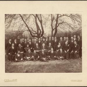 Missionaries in the London Conference of the British Mission, including Eliza Chipman (third chair from right) and Inez Knight (standing center), pose for a photo taken by T. C. Turner & Co. in London, circa February 1899. Henry W. Naisbitt of the mission presidency is seated at the desk. (PH 1666, Church History Library, Salt Lake City.)