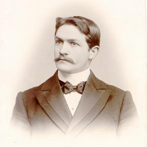 David O. McKay, president of the Scottish Conference of the British Mission and later president of The Church of Jesus Christ of Latter-day Saints, sits for a portrait taken by the studio of Watson & Wilson in Glasgow, Scotland. McKay wrote a message to fellow missionary Eliza Chipman on the back of the photo and dated it 21 August 1899. (MS 29199, Church History Library, Salt Lake City.)