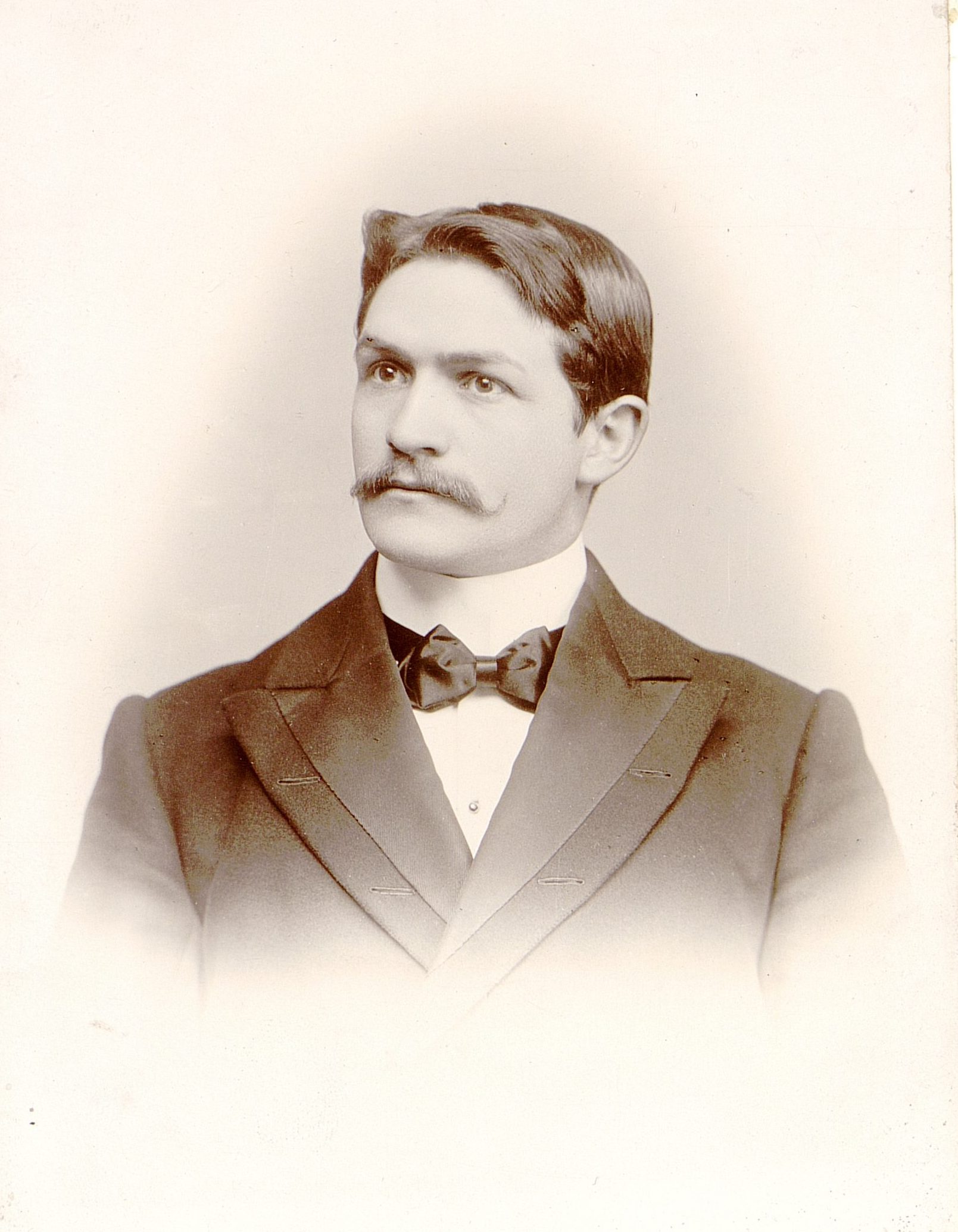 David O. McKay, president of the Scottish Conference of the British Mission and later president of The Church of Jesus Christ of Latter-day Saints, sits for a portrait taken by the studio of Watson & Wilson in Glasgow, Scotland. McKay wrote a message to fellow missionary Eliza Chipman on the back of the photo and dated it 21 August 1899. (MS 29199, Church History Library, Salt Lake City.)