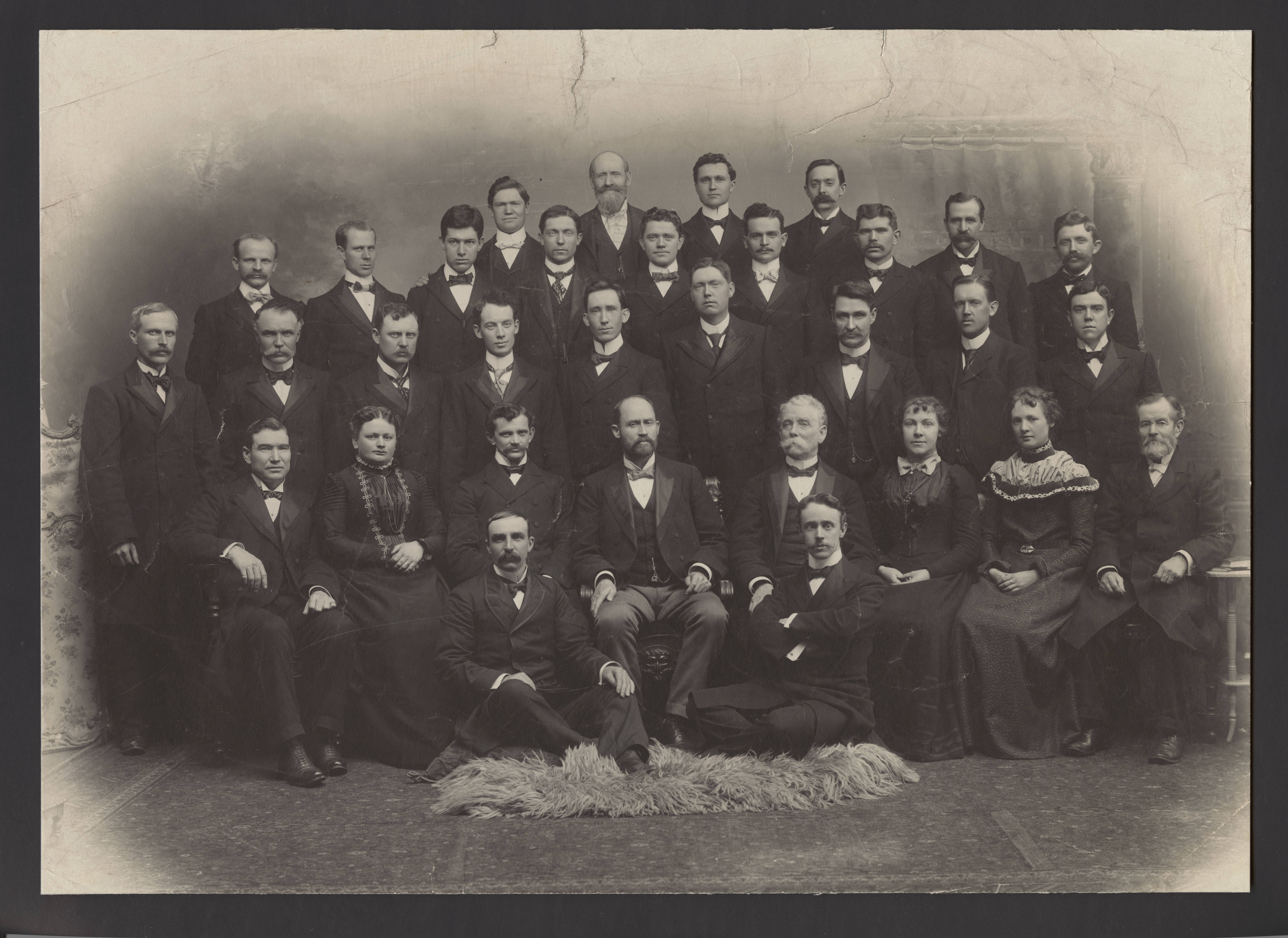 Eliza Chipman and Josephine Booth sit in the first row of chairs with fellow missionaries and leaders of the British Mission’s Scottish Conference on 3 December 1899. Seated on the floor are David N. Low (left) and Alexander Buchanan Jr. First row (from left): Henry B. Thompson, Mary Sanders Frame, James K. Miller, mission president Platte D. Lyman, counselor Henry W. Naisbitt, Chipman, Booth, Frederick A. Mitchell. Second row: Robert Crosbie, Neil M. Stewart, William Cameron, James H. Wickens, William M. Worthington, James H. Holland, Robert G. McQuarrie, Christopher Holland, George Bowman. Third row: John B. Young, William Lochhead, David C. Eccles, Joseph Holland, Matthew Miller, David Frame, William Gould, Thomas A. Kerr, Thomas McCaster. Back row: Raymond Thompson, John O. Freckleton, William H. Gardner, John S. Smith. (PH 1532, Church History Library, Salt Lake City.)