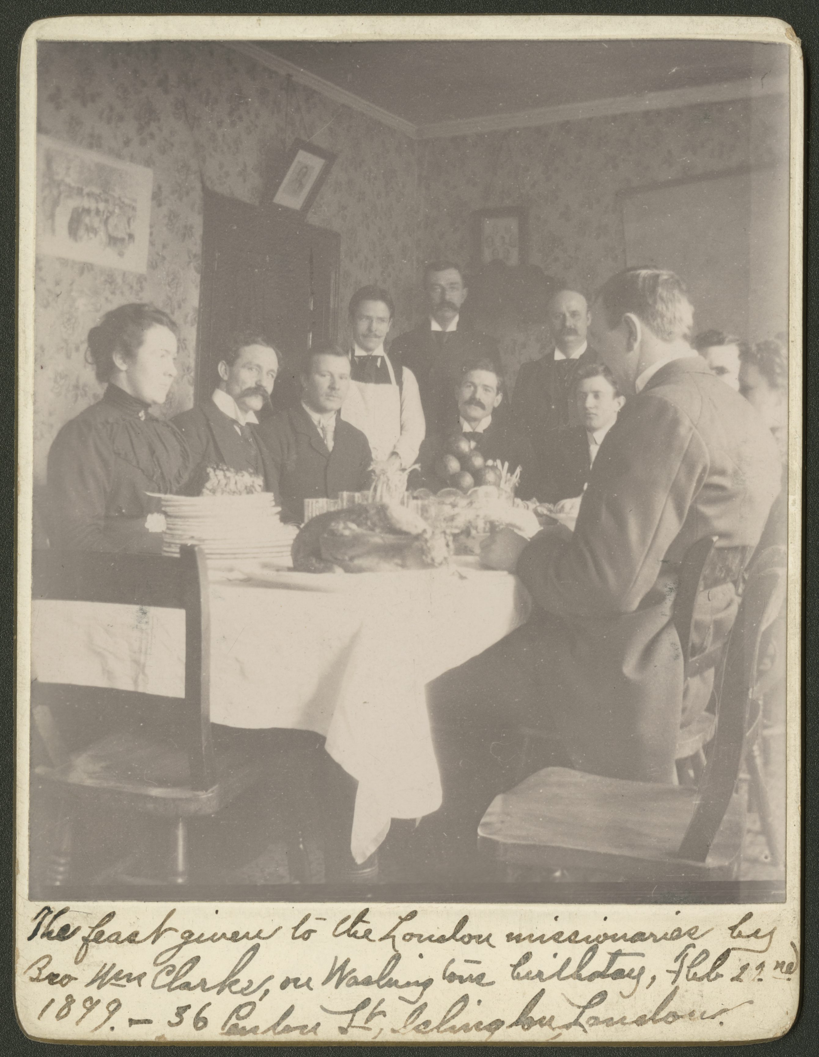 Missionaries celebrate George Washington’s birthday at 36 Penton Street, London, 22 February 1899: Eliza Chipman (left), John R. Hindley, Richard H. Hamblin, William C. Wright, Walter J. Knell, [first name unknown] Miles, Jabez W. West, [first name not given] Horsley, Frank L. Layton, Inez Knight, Raymond Knight. On the back of the photograph, Chipman noted humorously, “The turkey represents J. [Joseph] R. Squires on the picture and he represented the turkey in reality—or out of the picture.” (MS 29199, Church History Library, Salt Lake City.)