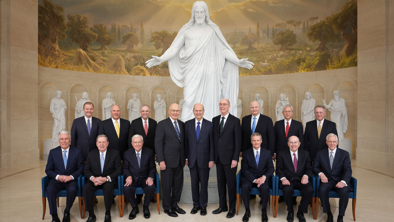 All the members of the First Presidency and the Quorum of the Twelve Apostles are seated or standing with the Christus Statue and statues of the Original Twelve at the Visitors' Center in Rome, Italy. Front Left to Right: Dieter F. Uchtdorf, Jeffrey R. Holland, M. Russell Ballard, Dallin H. Oaks, Russell M. Nelson, Henry B. Eyring, David A. Bednar, Quentin L. Cook, D. Todd Christofferson, Gary E. Stevenson, Ronald A. Rasband, Neil L. Andersen, Dale G. Renlund, Gerrit W. Gong, Ulisses Soares
