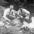 Gilbert Randall Tingey and Elder Kay Randall eating lunch on a Samoan trail, 1940