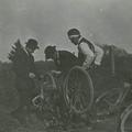 Missionaries repairing bicycles